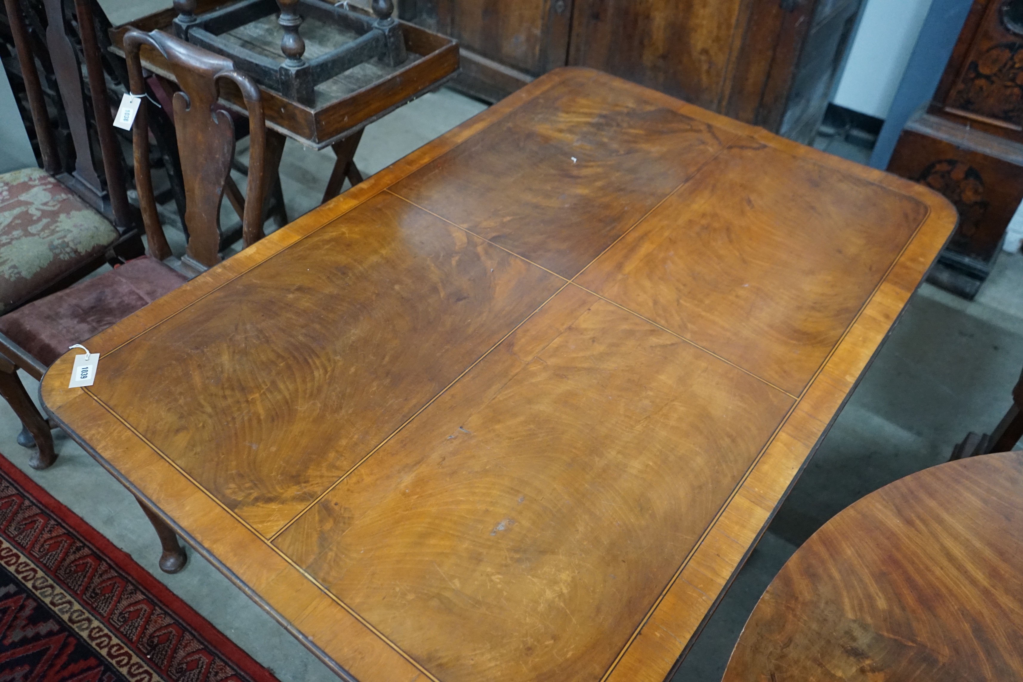 A George III satinwood banded rectangular mahogany tilt top dining table, length 152cm, depth 104cm, height 70cm